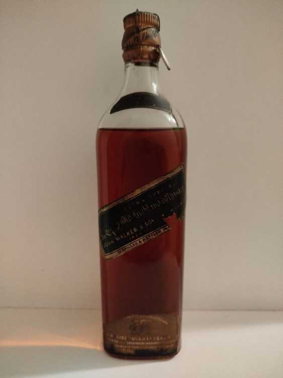 Johnnie Walker Extra Special Highland Whisky, no size, no abv; Guaranteed Over 12 years Old, By appointment to the late King George V Johnnie Walker Extra Special Highland Whisky, no size, no abv; Guaranteed Over 12 years Old, By appointment to the late King George V