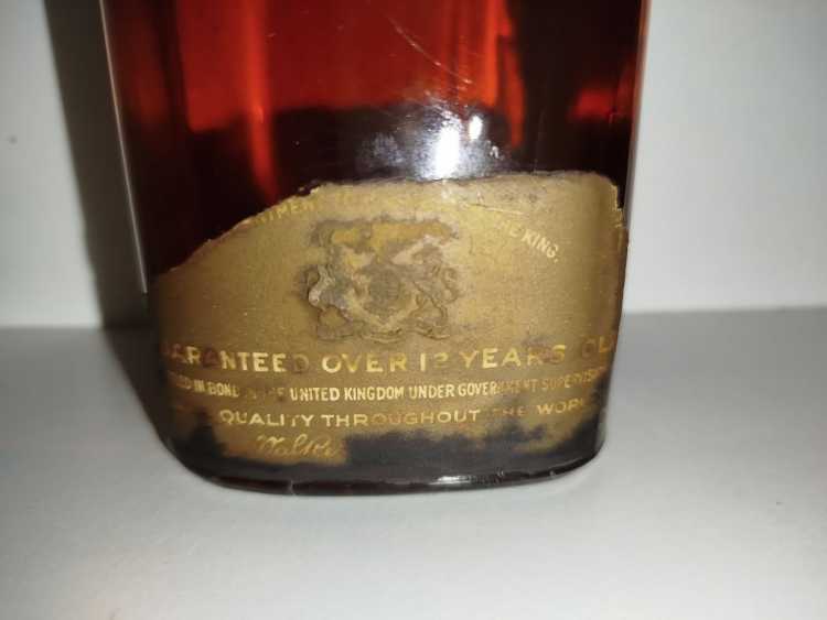 Johnnie Walker Extra Special Highland Whisky, no size, no abv; Guaranteed Over 12 years Old, By appointment to the late King George V Johnnie Walker Extra Special Highland Whisky, no size, no abv; Guaranteed Over 12 years Old, By appointment to the late King George V
